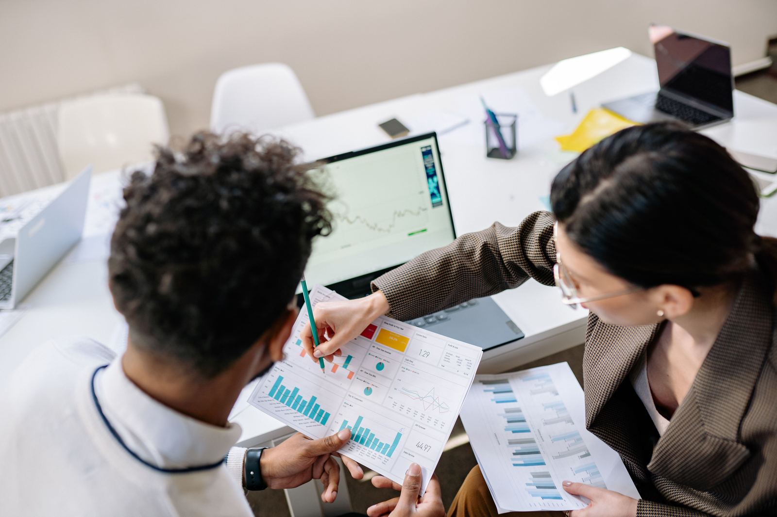 Munyai Consulting analysts reviewing research data and charts